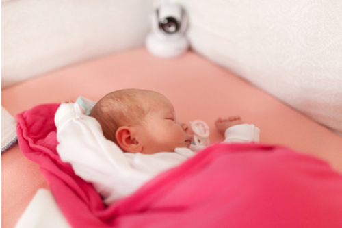 Baby asleep in crib